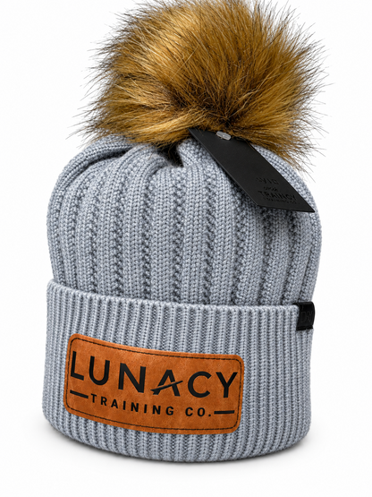 Knit beanie with faux fur pom pom