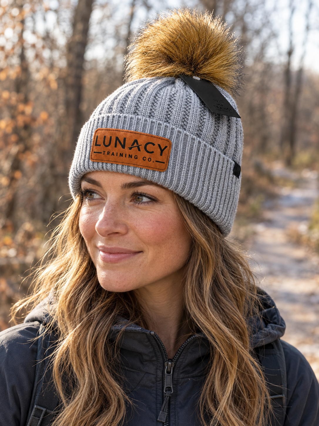 Knit beanie with faux fur pom pom